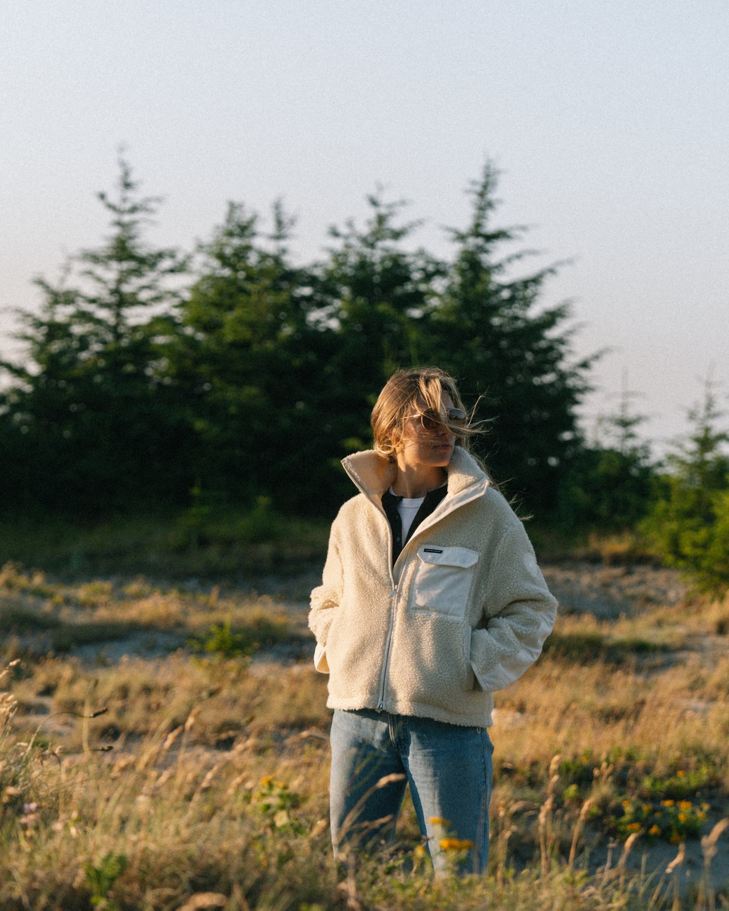 Canada Goose fleece, model standing in a field