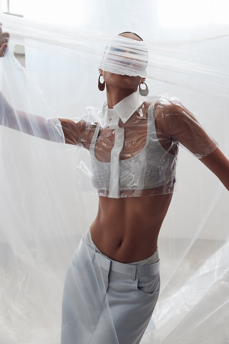 Models wear physical versions of AI-generated designs.