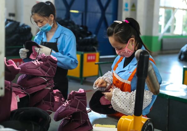 Factory workers in Qingdao in China's eastern Shandong province.