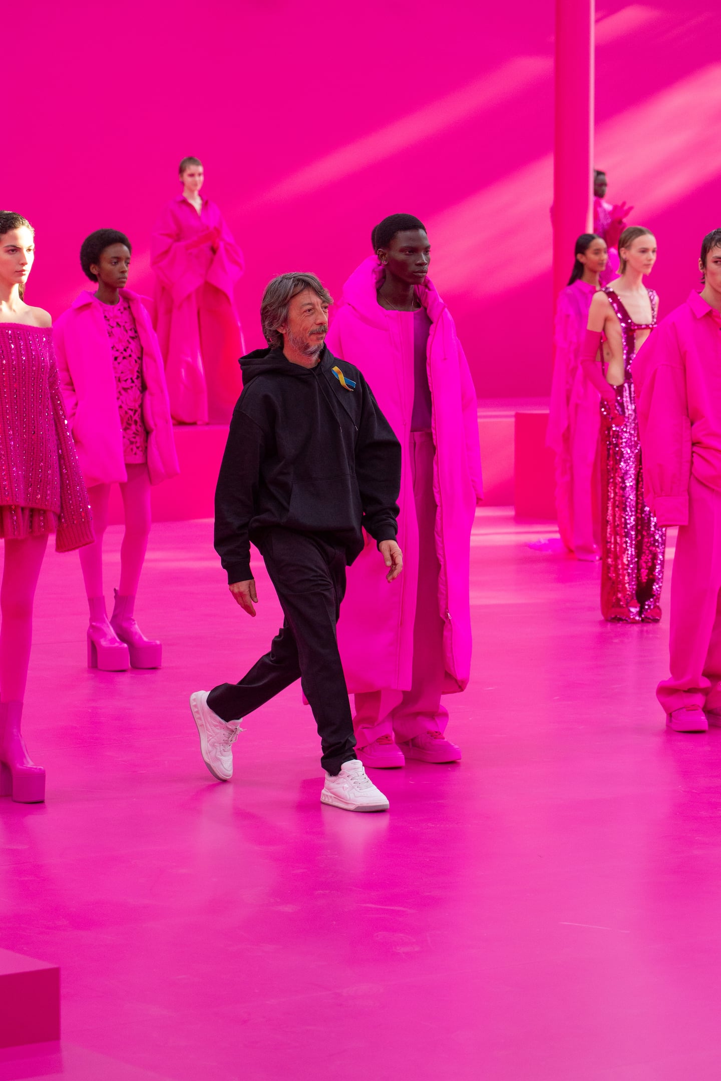 Creative director Pierpaolo Piccioli at Valentino's Autumn/Winter 2022 show, which has helped set off a pink flurry in fashion.