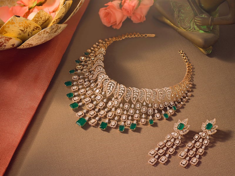 A Malabar Gold & Diamonds diamond necklace with earrings.