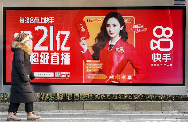 A billboard advertising Chinese short video app Kuaishou in Beijing, China. Getty Images.
