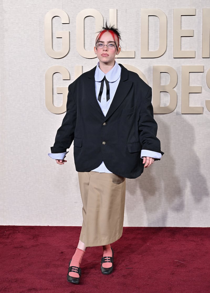 Billie Eilish attends the 81st Annual Golden Globe Awards wearing Willy Chavarria.