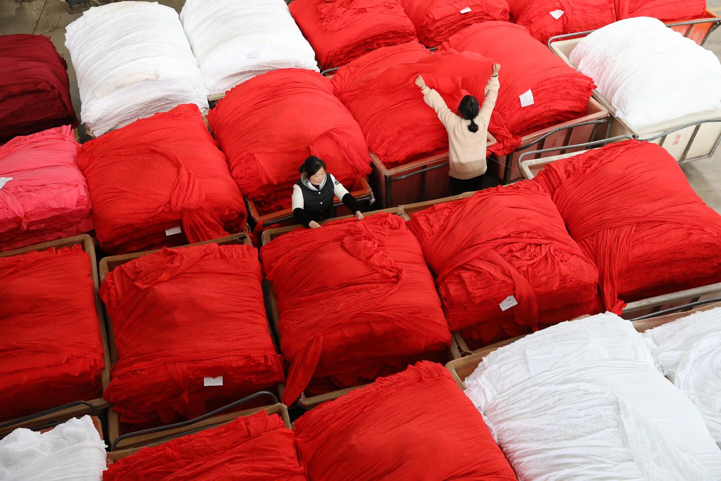 Workers in a fabric dye factory in Hangzhou, China.
