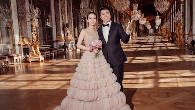 Gina Alice Redlinger, dressed in Nicole and Felicia Couture, with husband Lang Lang at the Palace of Versailles. Nicole and Felicia.