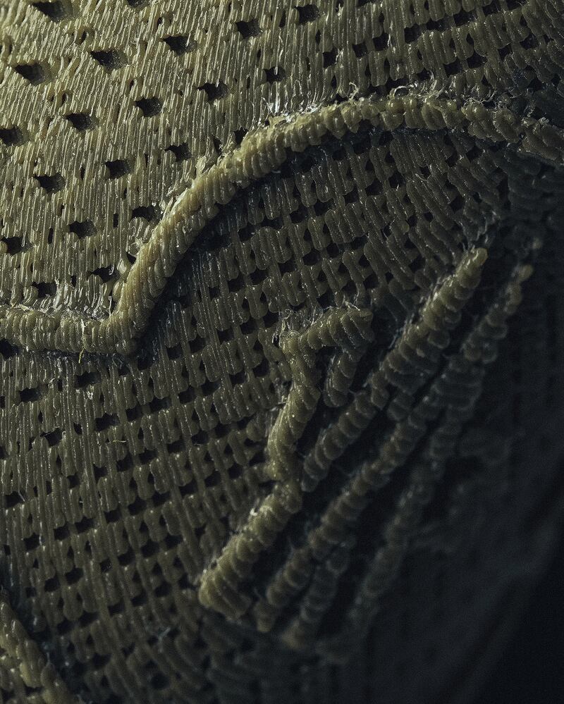 A close-up shot shows the texture of the 3D-printed material.