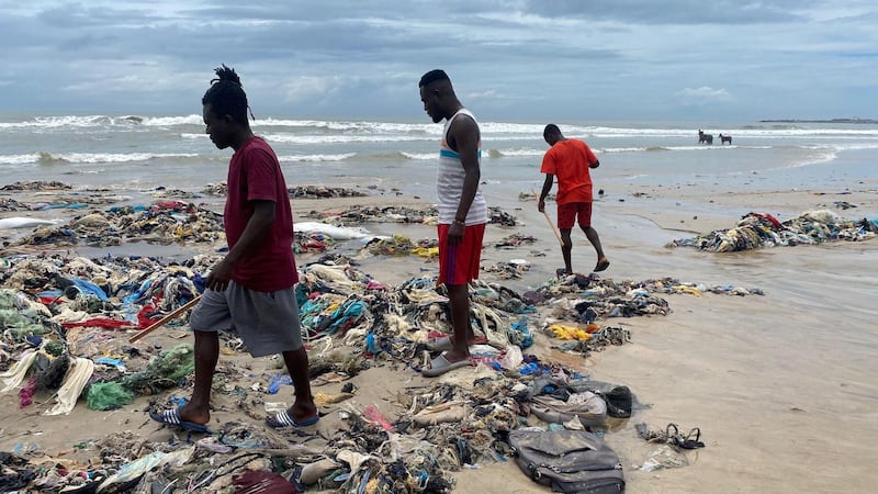 The Or Foundation’s beach monitoring team trawls through tangles of textile waste on a beach in Ghana.