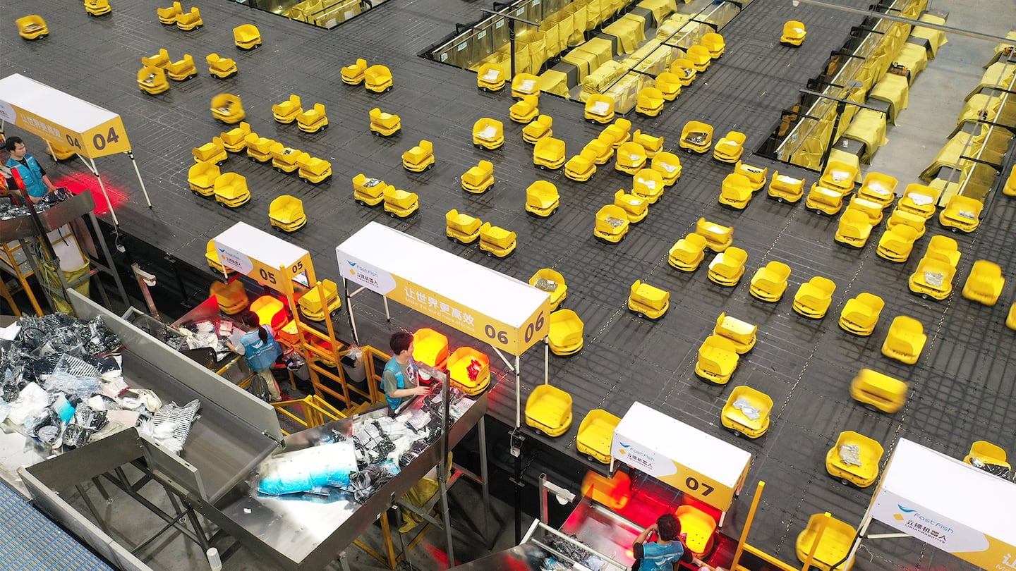 Autonomous robots sort express parcels at a logistics centre at Chinese apparel brand Fast Fish during the 618 Shopping Festival on June 18, 2026 in Deqing, China.