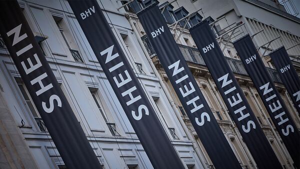 A row of Shein banners hang from the exterior of the BHV Marais department store in Paris.