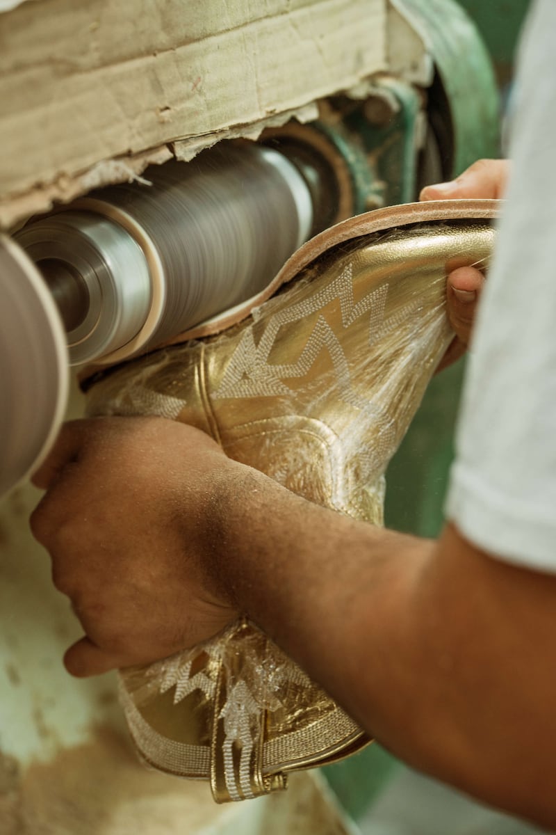 A Miron Crosby boot being made by a craftsman in a factory.