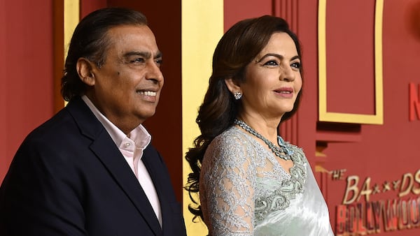 Mukesh Ambani, Reliance Industries’ chairman and managing director, and his wife Nita Ambani attend a Mumbai television premiere in September 2025.