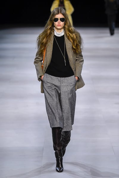 Slimane pivoted to a 70s inspired, "neo-bourgeois" aesthetic that proved influential. Indigital.