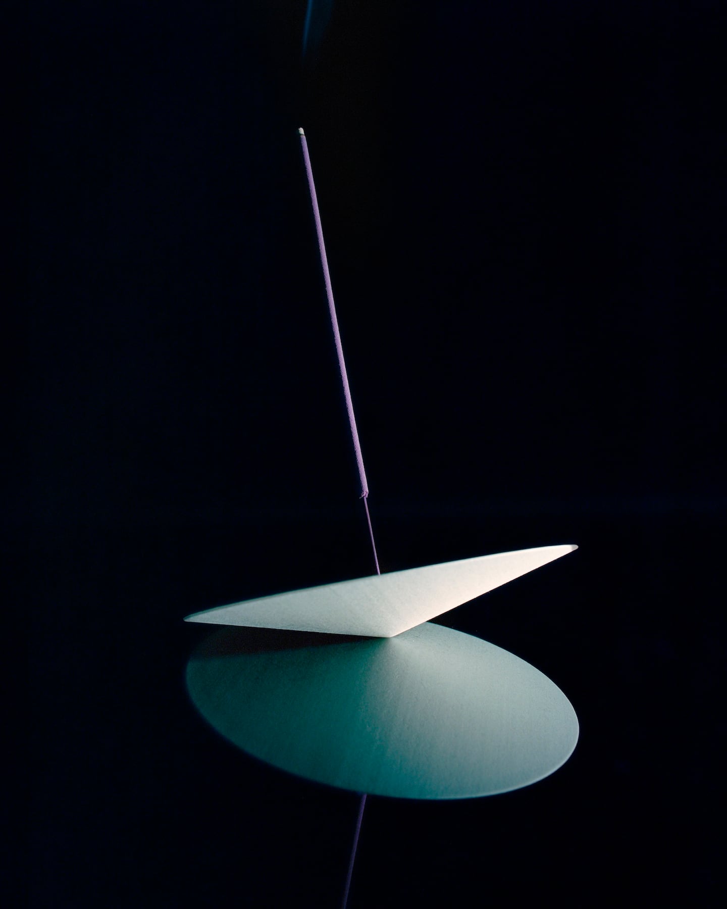A still life of Vyrao incense on a black background