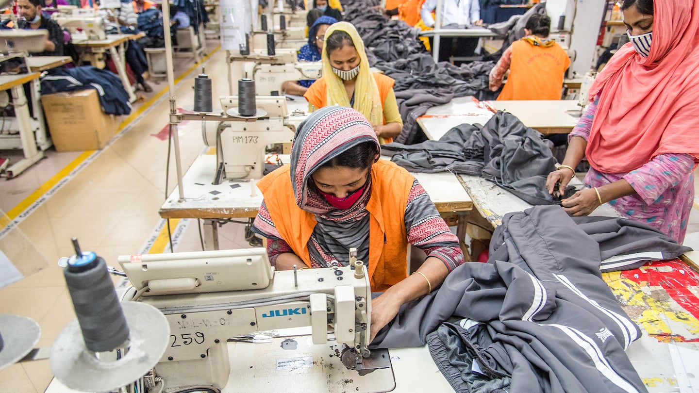 Women sew sweatpants at a factory in Bangladesh.