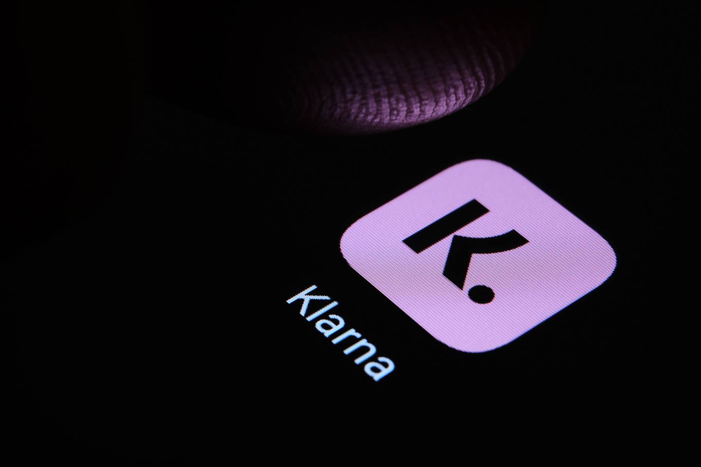 Klarna app on a black screen.