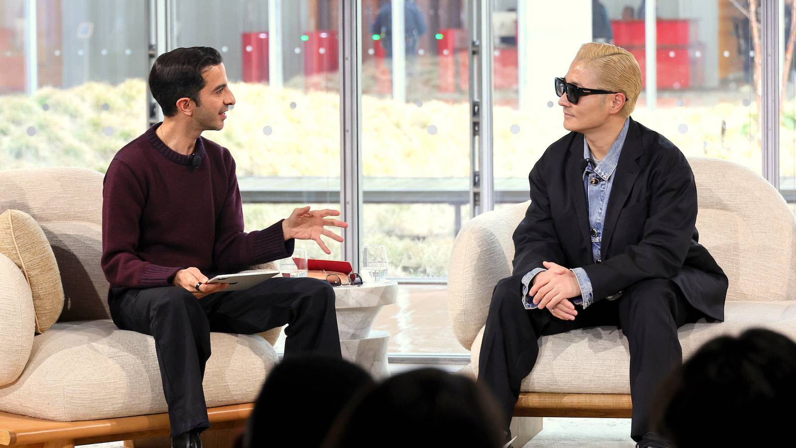 Imran Amed, Founder and CEO of The Business of Fashion, and VERBAL, Chief Executive and Artist, AMBUSH®, seated on stage at The BoF Professional Summit at The Times Center in New York City.