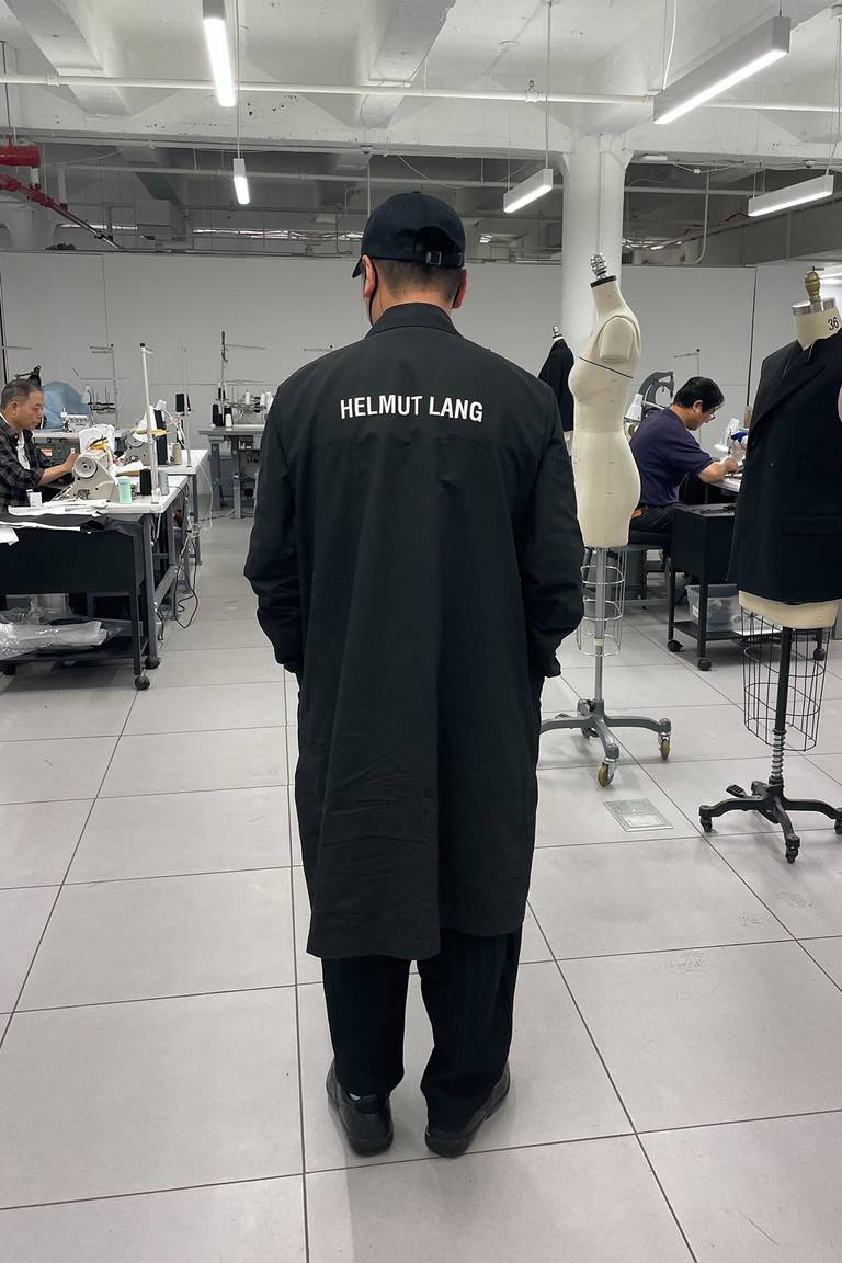 Designer Peter Do wears a Helmut Lang jacket in his atelier.