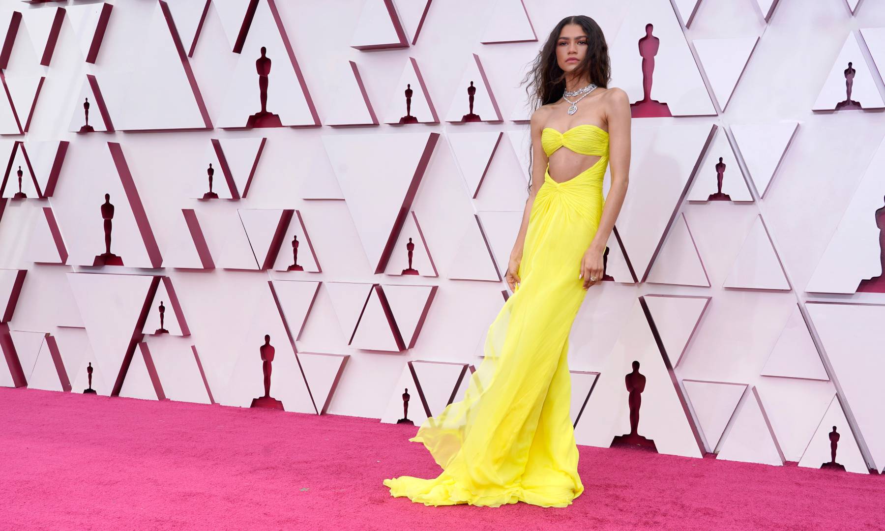 Zendaya poses on a socially-distant red carpet at the 2021 Academy Awards.