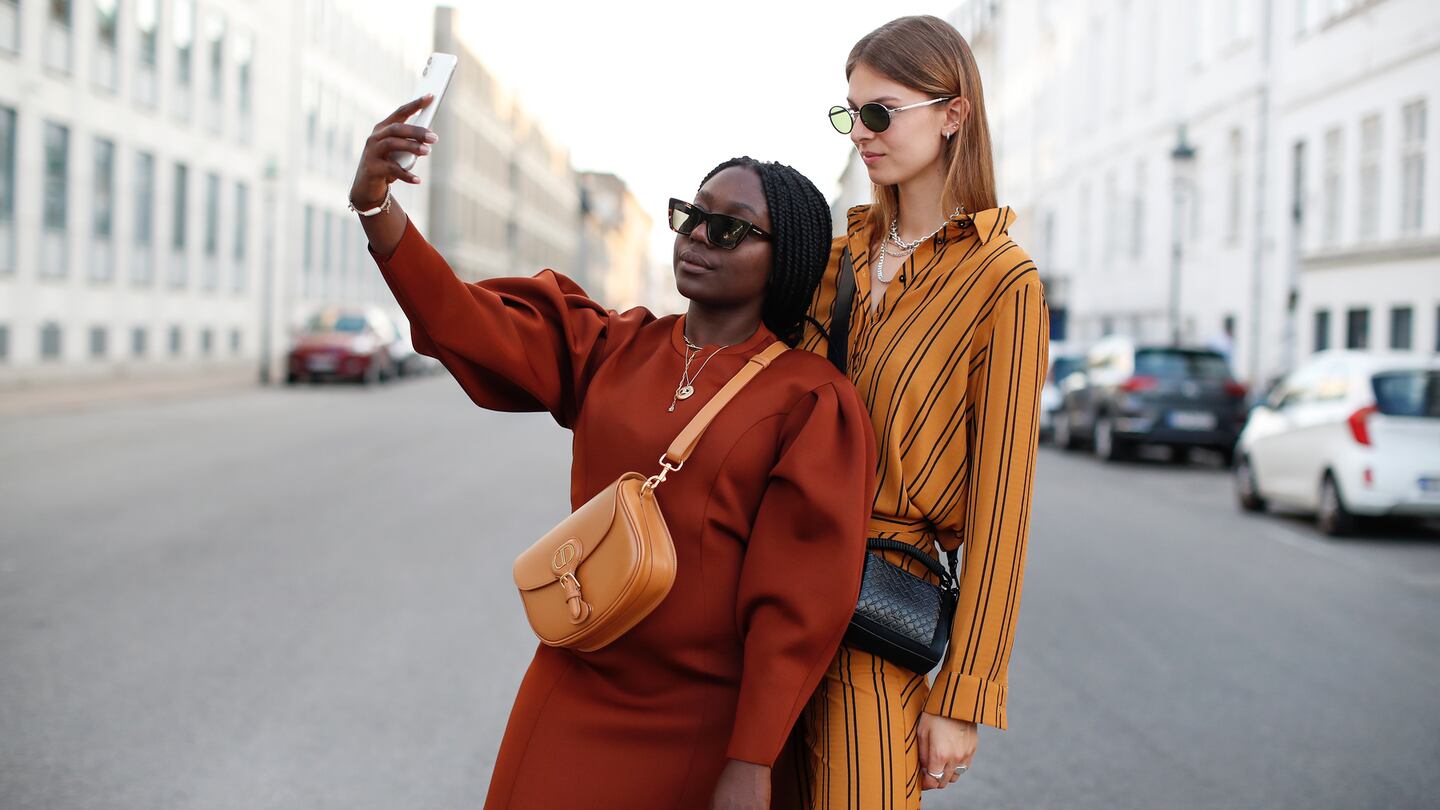 Influencers Lois Opoku and Jacqueline Zelwis during Copenhagen Fashion Week. Getty Images.